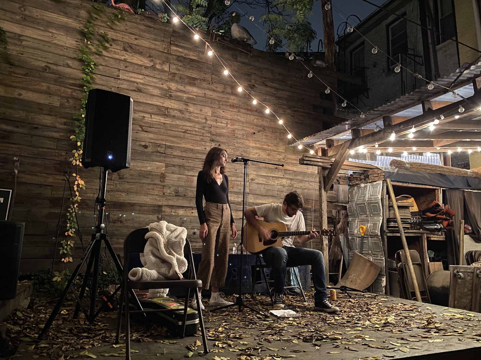 guitarist & singer, beautiful wooden wall behind them