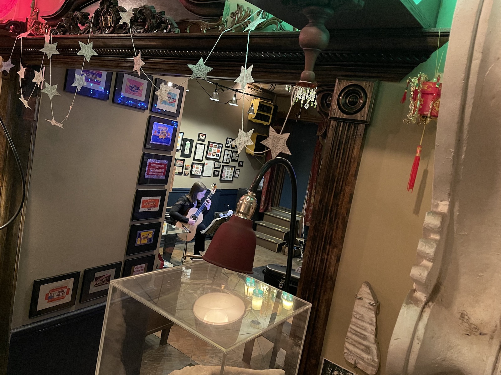 classical guitarist in tiny history museum