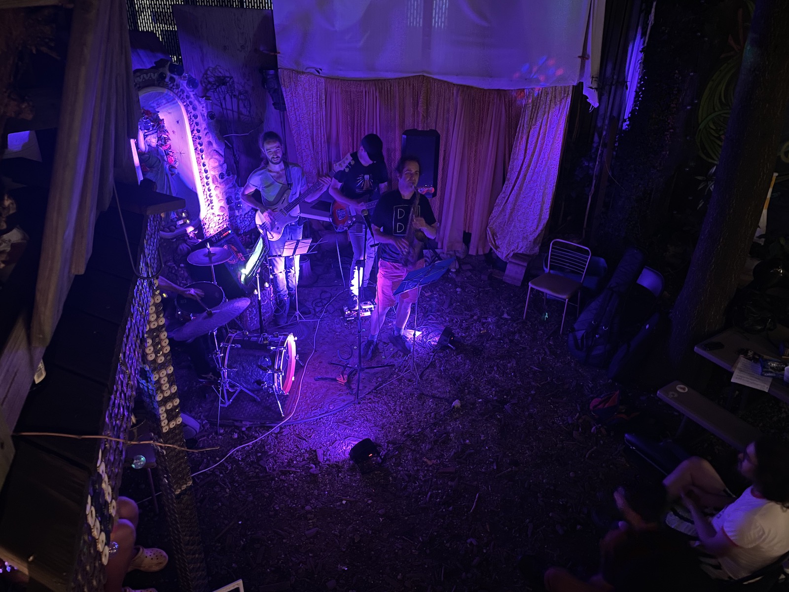 saxophone rock band in front of secular shrine