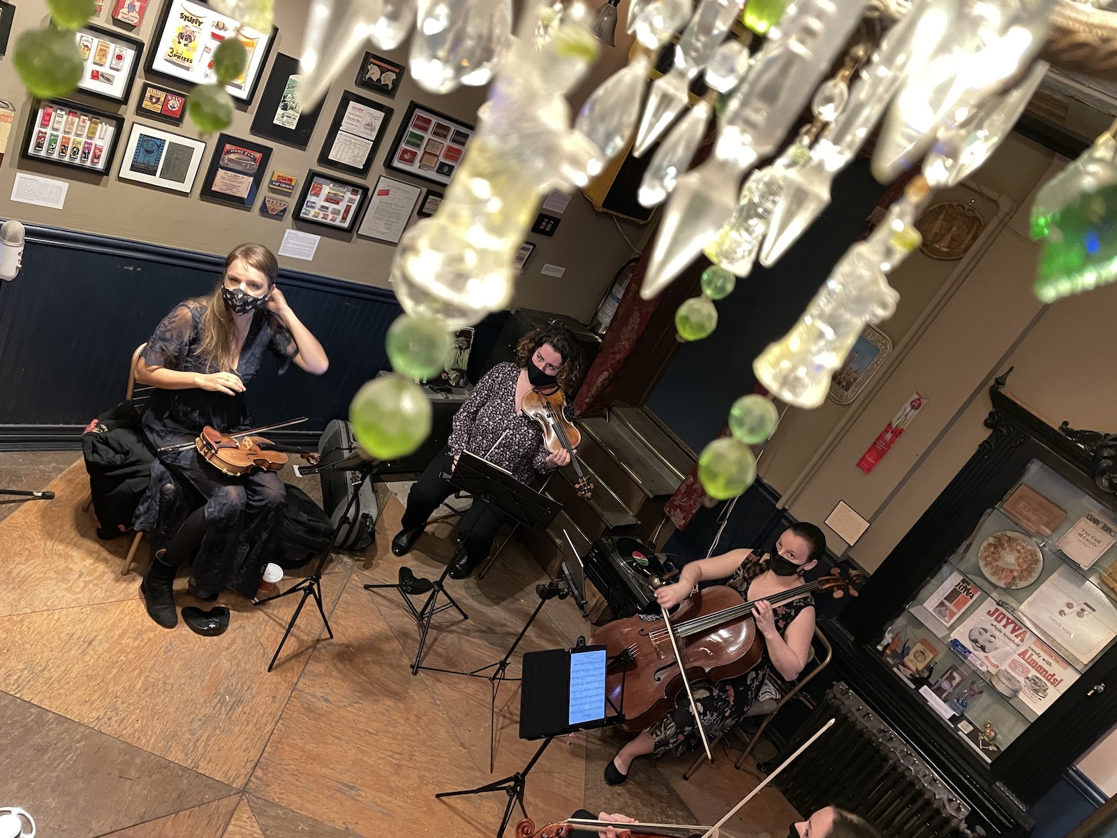 a quartet tunes in a tiny history museum